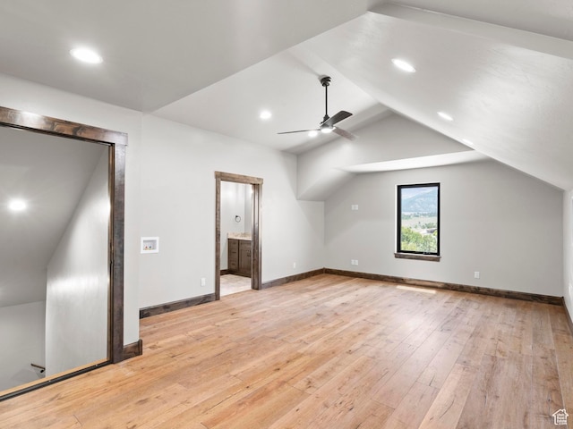 additional living space with vaulted ceiling, baseboards, light wood-style floors, ceiling fan, and recessed lighting