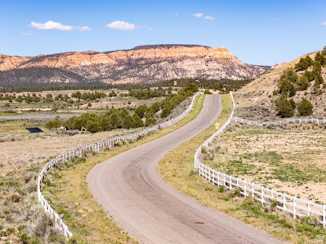 view of mountain feature with a rural view