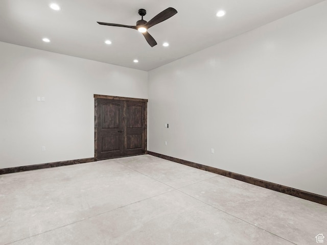 unfurnished bedroom featuring ceiling fan, baseboards, finished concrete floors, and recessed lighting