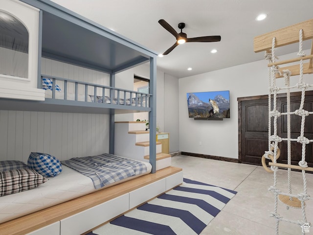 bedroom featuring baseboards, concrete floors, and recessed lighting