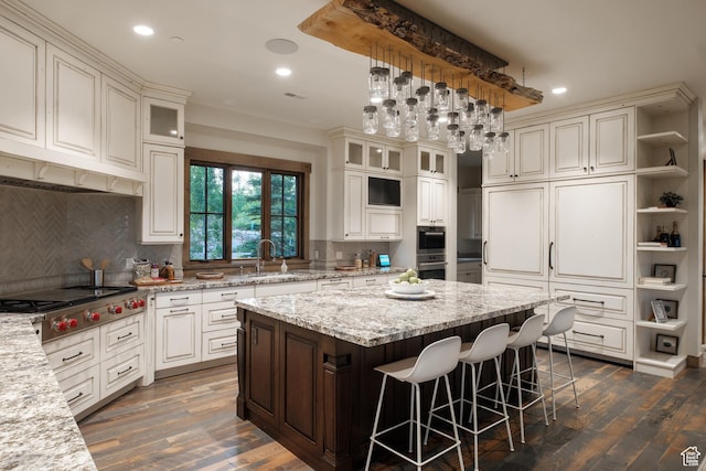 2586 N Whispering Springs Hollow Rd Unit 20, Heber City, UT 84032 - kitchen with a kitchen island, open shelves, recessed lighting, appliances with stainless steel finishes, and a kitchen breakfast bar