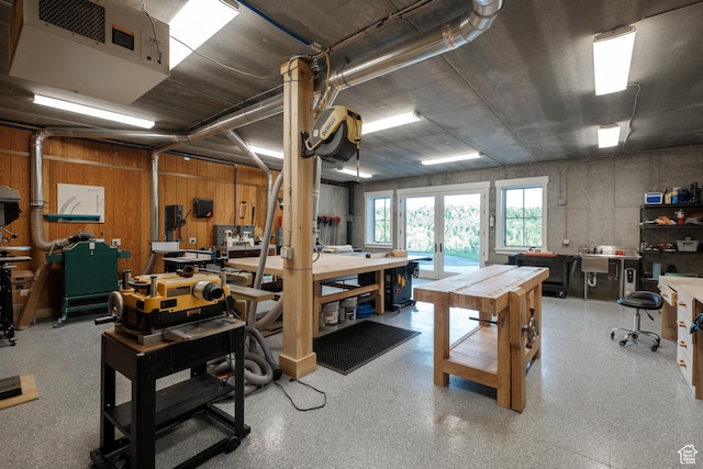 2586 N Whispering Springs Hollow Rd Unit 20, Heber City, UT 84032 - basement with a workshop area, french doors, a heating unit, and wooden walls
