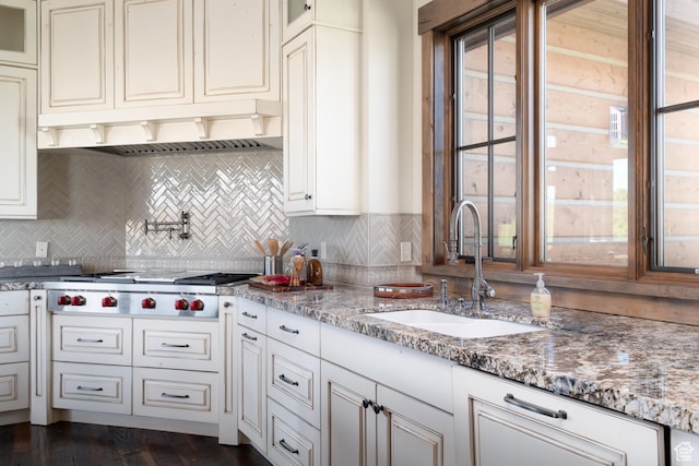 2586 N Whispering Springs Hollow Rd Unit 20, Heber City, UT 84032 - kitchen featuring stainless steel gas cooktop, ventilation hood, glass insert cabinets, and decorative backsplash