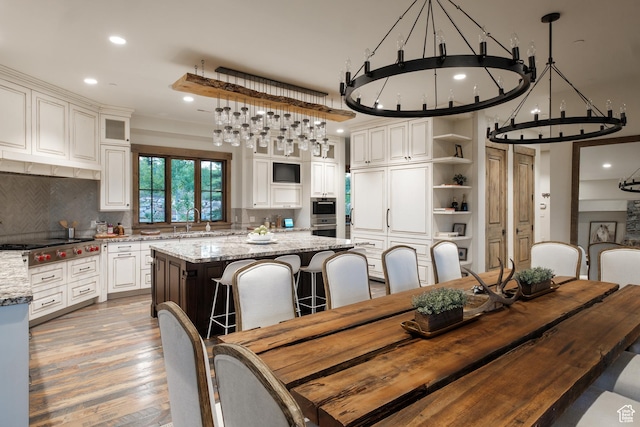 2586 N Whispering Springs Hollow Rd Unit 20, Heber City, UT 84032 - dining area with a chandelier, recessed lighting, and light wood finished floors