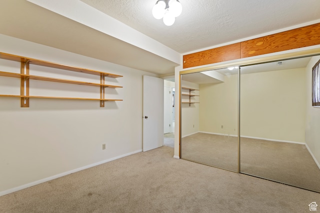 142 S Eccles Ave, Ogden, UT 84404 - unfurnished bedroom with a closet, carpet floors, and a textured ceiling