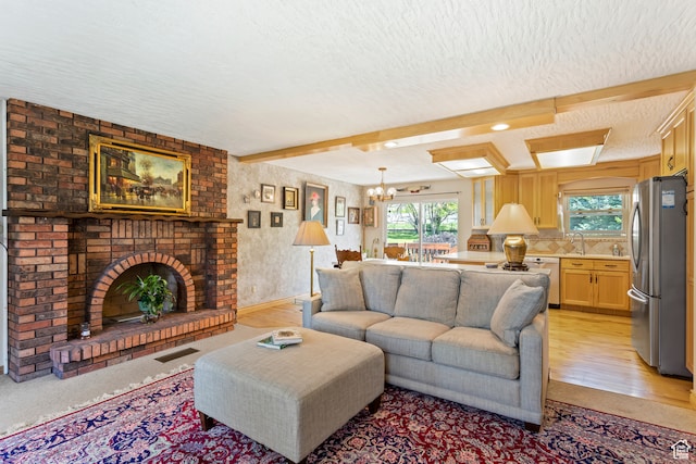 142 S Eccles Ave, Ogden, UT 84404 - carpeted living room with beamed ceiling, a brick fireplace, brick wall, an inviting chandelier, and a textured ceiling