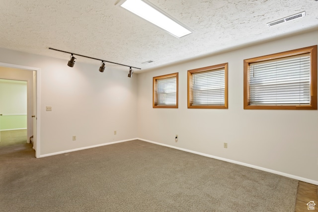 142 S Eccles Ave, Ogden, UT 84404 - carpeted spare room featuring track lighting and a textured ceiling