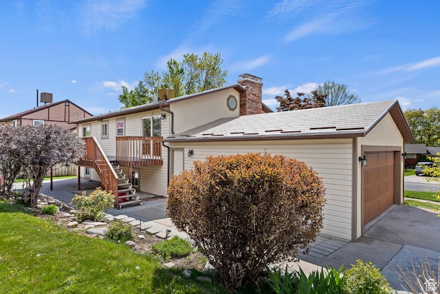 142 S Eccles Ave, Ogden, UT 84404 - view of front facade featuring a deck and a garage