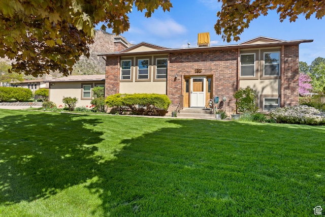 142 S Eccles Ave, Ogden, UT 84404 - view of front of house featuring a front lawn