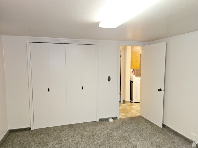 816 N 3500 W, Vernal, UT 84078 - unfurnished bedroom with light colored carpet, a closet, and washer / dryer