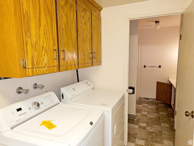 816 N 3500 W, Vernal, UT 84078 - laundry room with washer and dryer, cabinet space, and stone finish floors