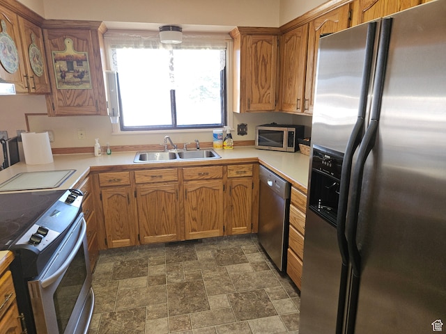 816 N 3500 W, Vernal, UT 84078 - kitchen featuring stainless steel appliances, light countertops, stone finish floors, and brown cabinetry