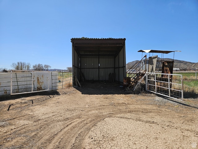 816 N 3500 W, Vernal, UT 84078 - view of outdoor structure with a carport, an exterior structure, and dirt driveway