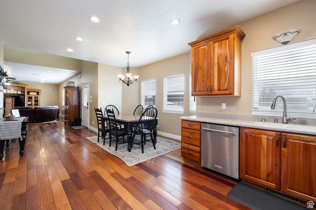 2120 N 2500 W, Vernal, UT 84078 - kitchen with hanging light fixtures, dark hardwood / wood-style flooring, an inviting chandelier, stainless steel dishwasher, and sink