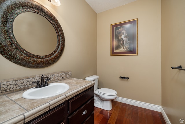 2120 N 2500 W, Vernal, UT 84078 - bathroom featuring wood-type flooring, oversized vanity, and toilet
