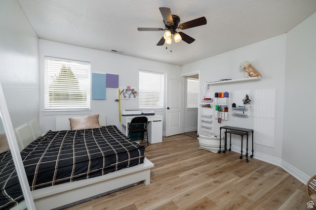 2120 N 2500 W, Vernal, UT 84078 - bedroom featuring ceiling fan, multiple windows, and light wood-type flooring