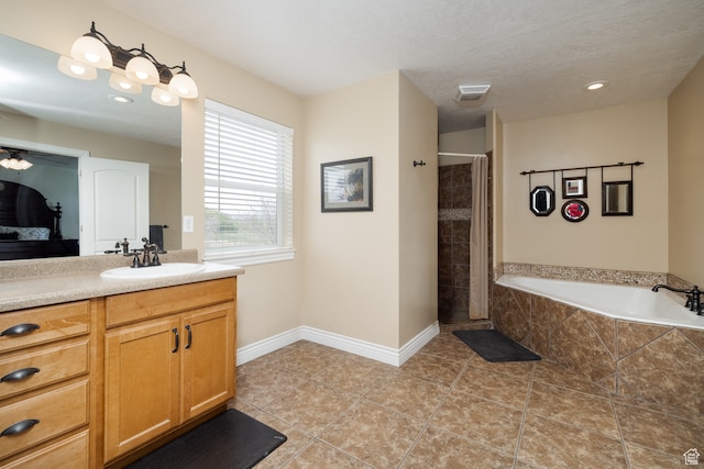 2120 N 2500 W, Vernal, UT 84078 - bathroom with tile flooring, separate shower and tub, vanity, and a textured ceiling