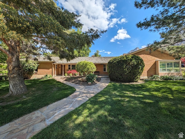 1235 E 820 N, Provo, UT 84606 - ranch-style house with a front yard and brick siding