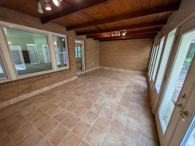 1235 E 820 N, Provo, UT 84606 - unfurnished sunroom featuring plenty of natural light, wood ceiling, tile patterned floors, and brick wall