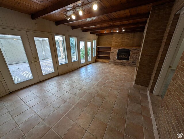 1235 E 820 N, Provo, UT 84606 - unfurnished living room featuring rail lighting, french doors, beamed ceiling, and wooden ceiling