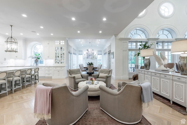 4250 S Camille St, Holladay, UT 84124 - living room featuring an inviting chandelier, ornamental molding, and light parquet flooring