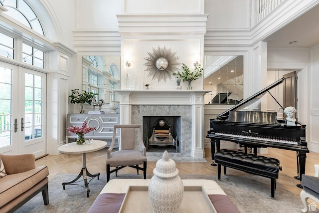 4250 S Camille St, Holladay, UT 84124 - sitting room with a high ceiling, parquet floors, a fireplace, and french doors