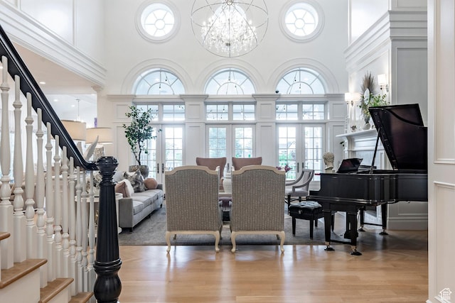 4250 S Camille St, Holladay, UT 84124 - dining area featuring an inviting chandelier, light hardwood / wood-style floors, a high ceiling, and a wealth of natural light