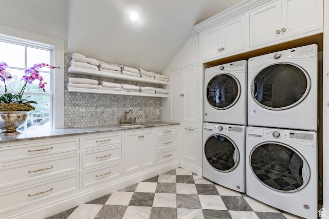 4250 S Camille St, Holladay, UT 84124 - washroom with sink, washing machine and dryer, cabinets, and stacked washer / drying machine