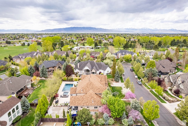 birds eye view of property with a mountain view