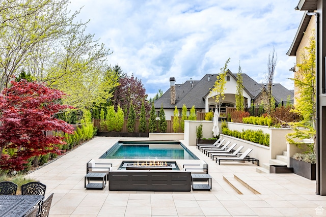 view of swimming pool with a jacuzzi and a patio area