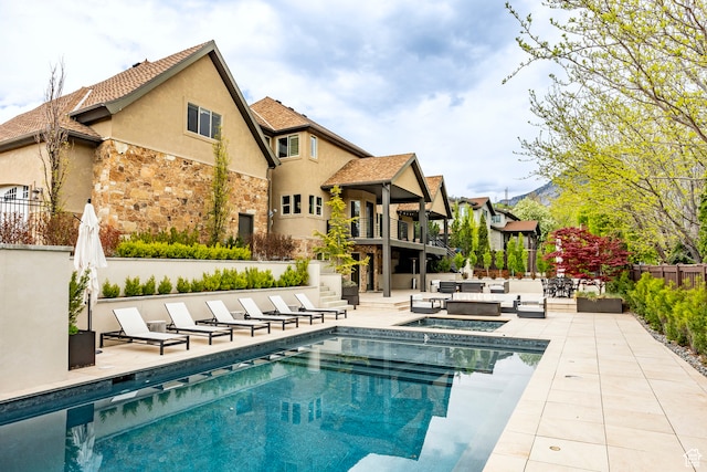 view of pool featuring outdoor lounge area and a patio area