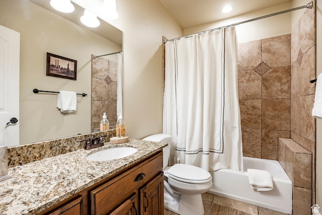 full bathroom with tile floors, large vanity, toilet, and shower / tub combo with curtain