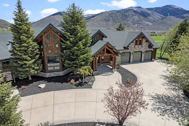 5650 N Franson Ln, Oakley, UT 84055 - view of front facade featuring a garage and a mountain view