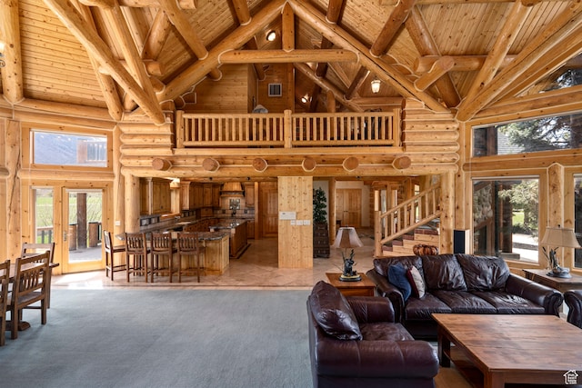 5650 N Franson Ln, Oakley, UT 84055 - tiled living room with high vaulted ceiling, rustic walls, beam ceiling, and wood ceiling