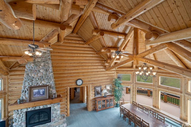 5650 N Franson Ln, Oakley, UT 84055 - interior space featuring a stone fireplace, beam ceiling, log walls, and wooden ceiling