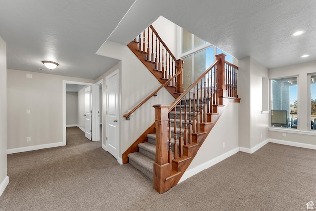 885 S Southflat Rd, Huntington, UT 84528 - stairs featuring a textured ceiling and carpet flooring