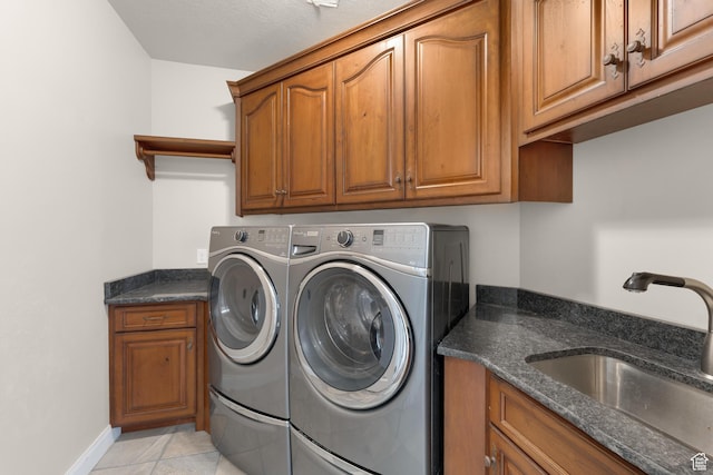 885 S Southflat Rd, Huntington, UT 84528 - laundry area with sink, cabinets, light tile floors, and washing machine and dryer