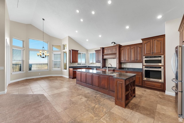 885 S Southflat Rd, Huntington, UT 84528 - kitchen with an island with sink, stainless steel appliances, dark stone countertops, light tile floors, and a chandelier