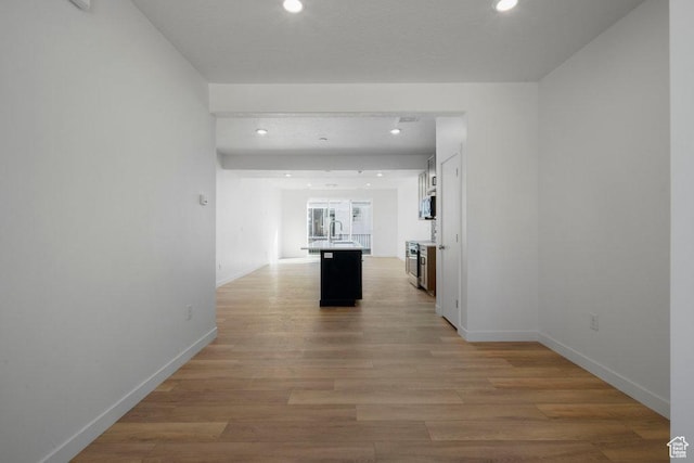 4126 S Winder Ward Dr Unit 2-123, Millcreek, UT 84124 - hallway featuring recessed lighting, light wood-style flooring, and baseboards