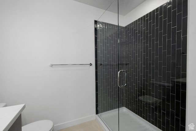 4126 S Winder Ward Dr Unit 2-123, Millcreek, UT 84124 - bathroom with toilet, a shower stall, vanity, tile patterned floors, and baseboards
