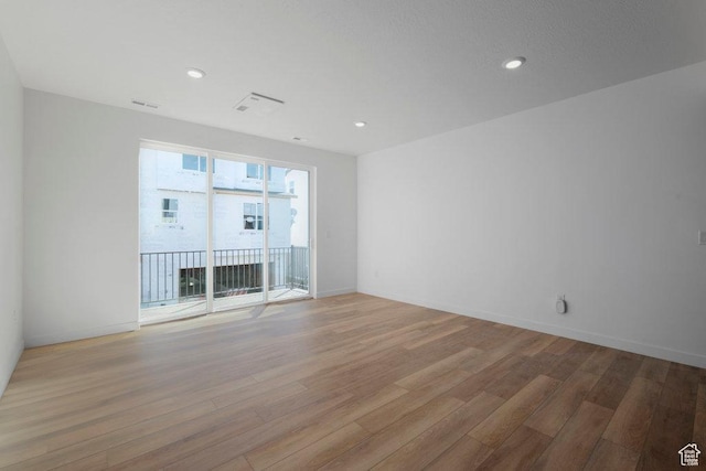 4126 S Winder Ward Dr Unit 2-123, Millcreek, UT 84124 - spare room featuring light wood finished floors, recessed lighting, and baseboards