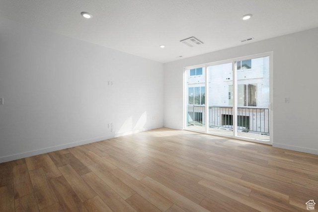 4126 S Winder Ward Dr Unit 2-123, Millcreek, UT 84124 - unfurnished room featuring light wood-type flooring, recessed lighting, and baseboards