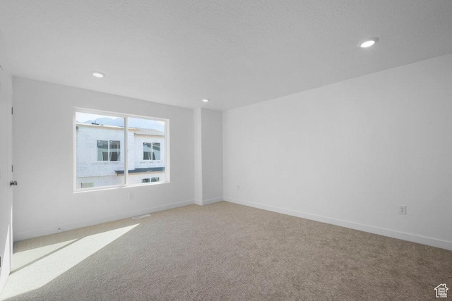 4126 S Winder Ward Dr Unit 2-123, Millcreek, UT 84124 - spare room featuring light colored carpet, recessed lighting, and baseboards