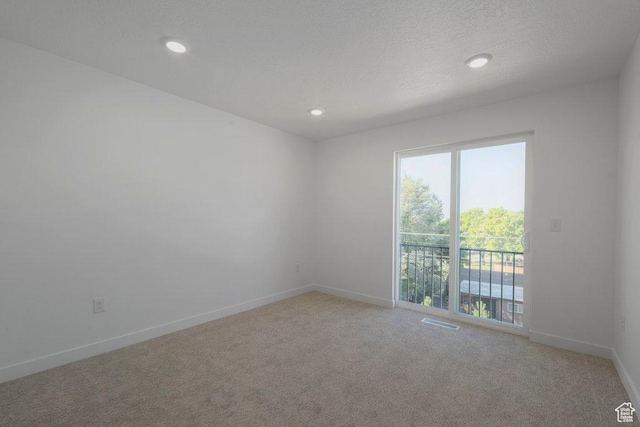 4126 S Winder Ward Dr Unit 2-123, Millcreek, UT 84124 - empty room featuring light colored carpet, baseboards, and recessed lighting