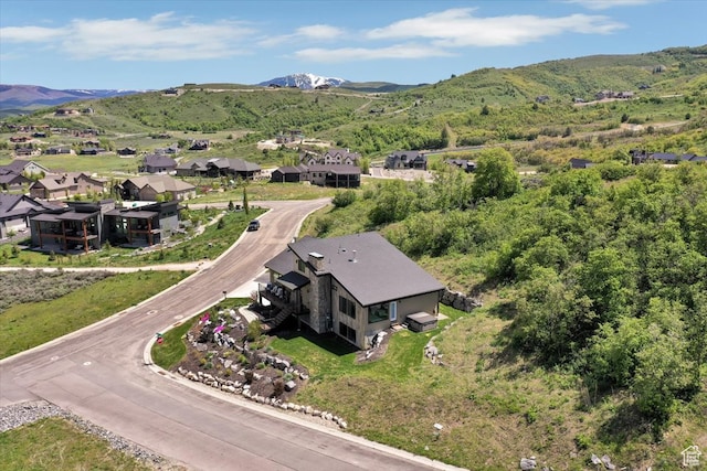 birds eye view of property featuring a mountain view