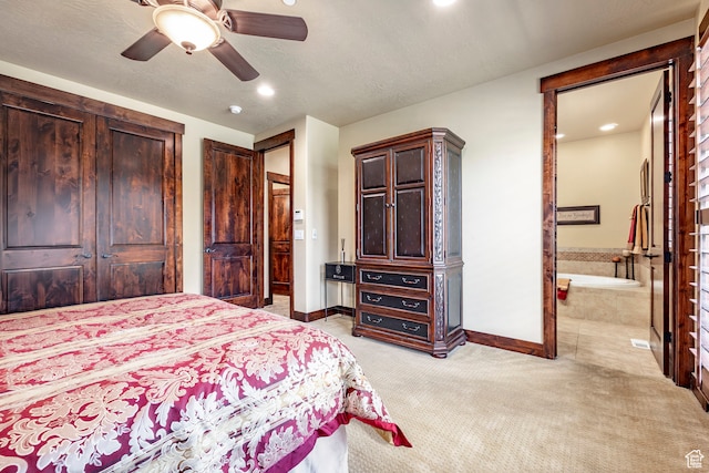 1621 E Abajo Peak Ct, Heber City, UT 84032 - bedroom with light colored carpet, ensuite bath, ceiling fan, and a textured ceiling