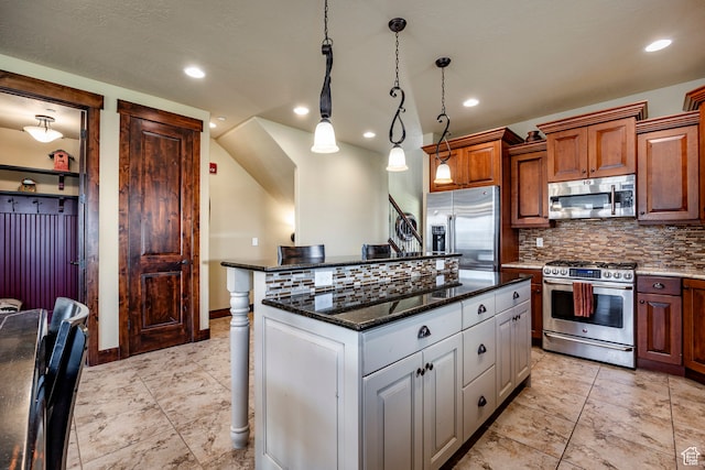1621 E Abajo Peak Ct, Heber City, UT 84032 - kitchen with decorative light fixtures, dark stone counters, backsplash, a center island, and appliances with stainless steel finishes