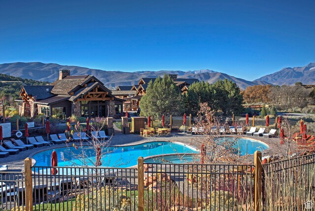 1621 E Abajo Peak Ct, Heber City, UT 84032 - view of swimming pool with a patio area and a mountain view