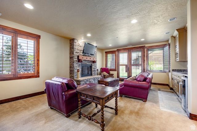 1621 E Abajo Peak Ct, Heber City, UT 84032 - living room with a healthy amount of sunlight, a textured ceiling, a fireplace, and light colored carpet