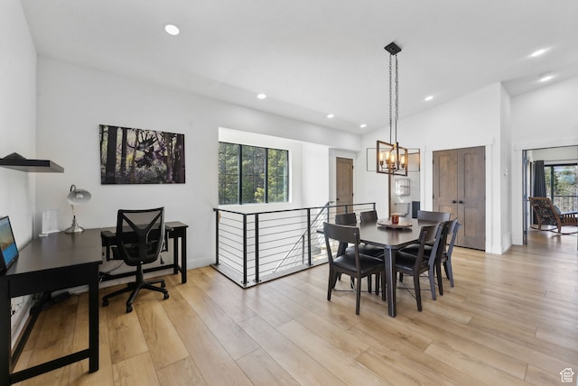 1430 W Arapaho Dr Unit 59, Coalville, UT 84017 - dining area with lofted ceiling, a notable chandelier, and light wood-type flooring